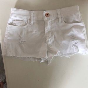 white ripped cut offs